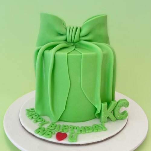 Green ribbon theme cake