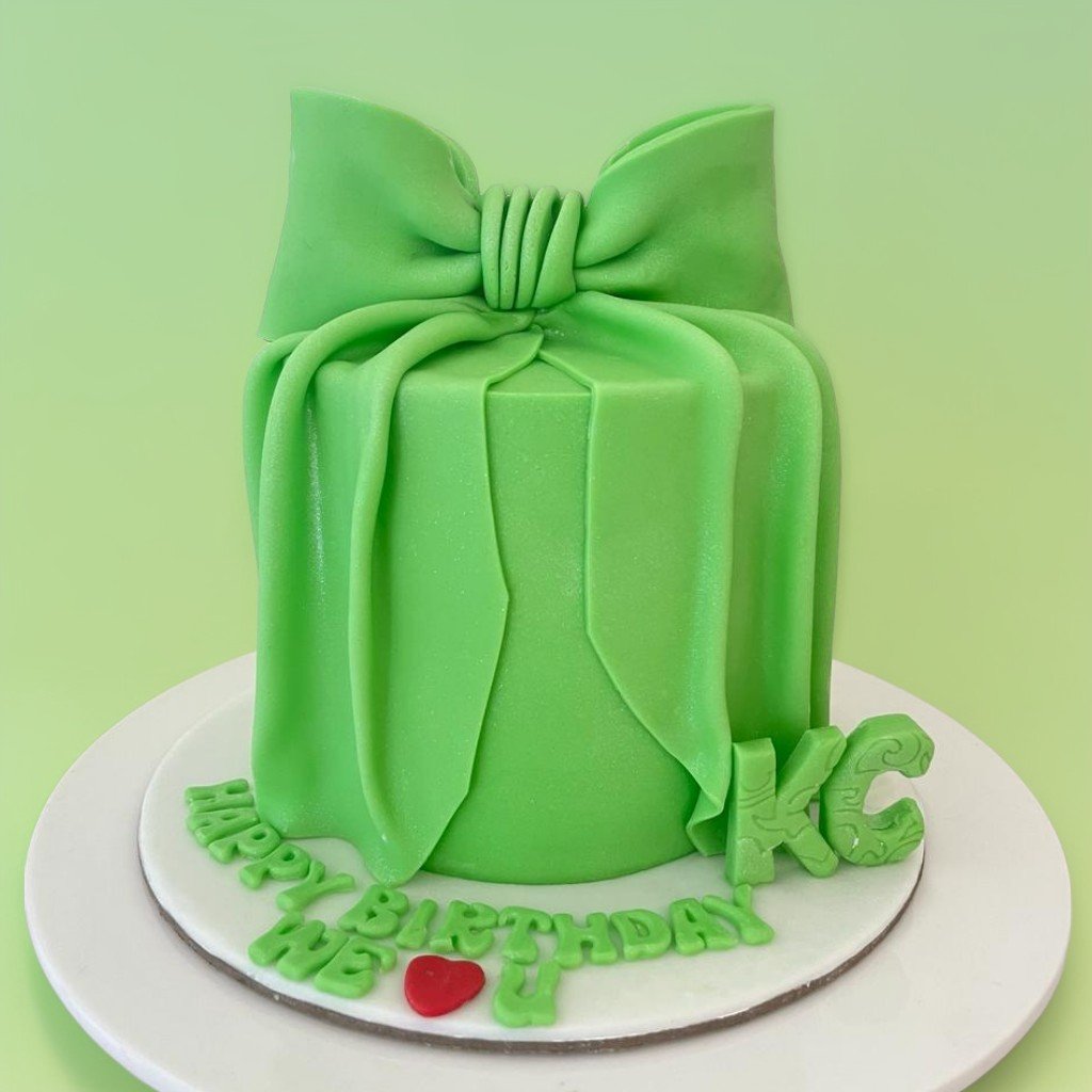 Green ribbon theme cake